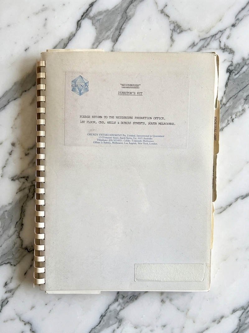 Book with a cover featuring text on a marble surface