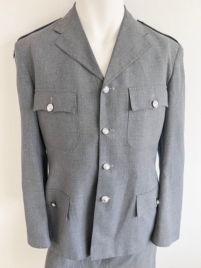 Grey prison governor uniform jacket on a mannequin against a white background