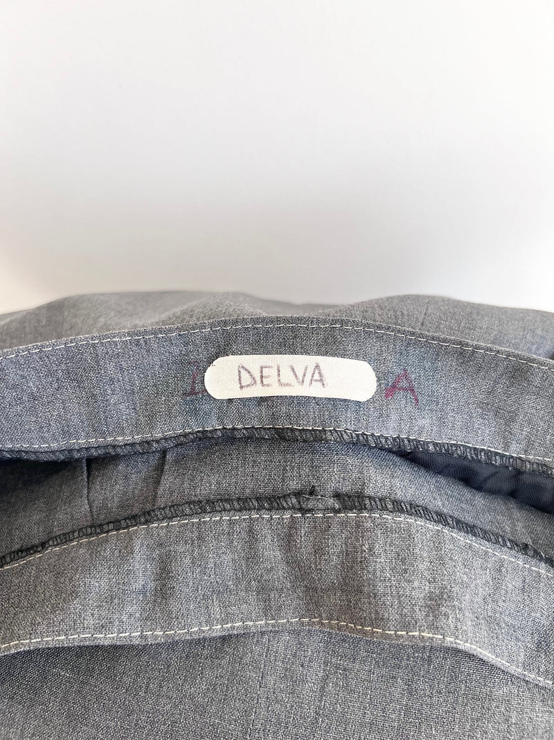 Grey prison governor jacket with 'Delva' label on a white background