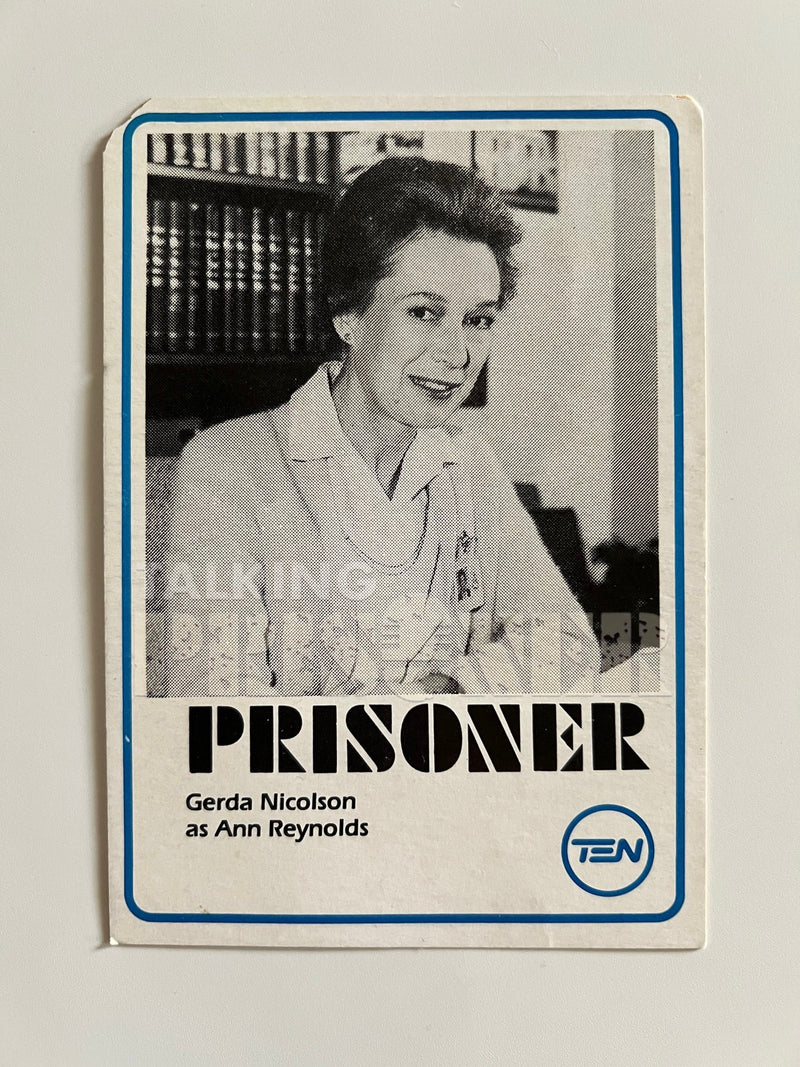 Trading card featuring a woman with text about 'The Prisoner' and 'TEN' on a light gray background