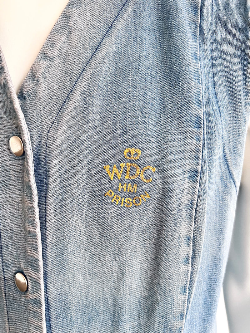 Denim jacket with 'WDC HM PRISON' embroidery on a white background