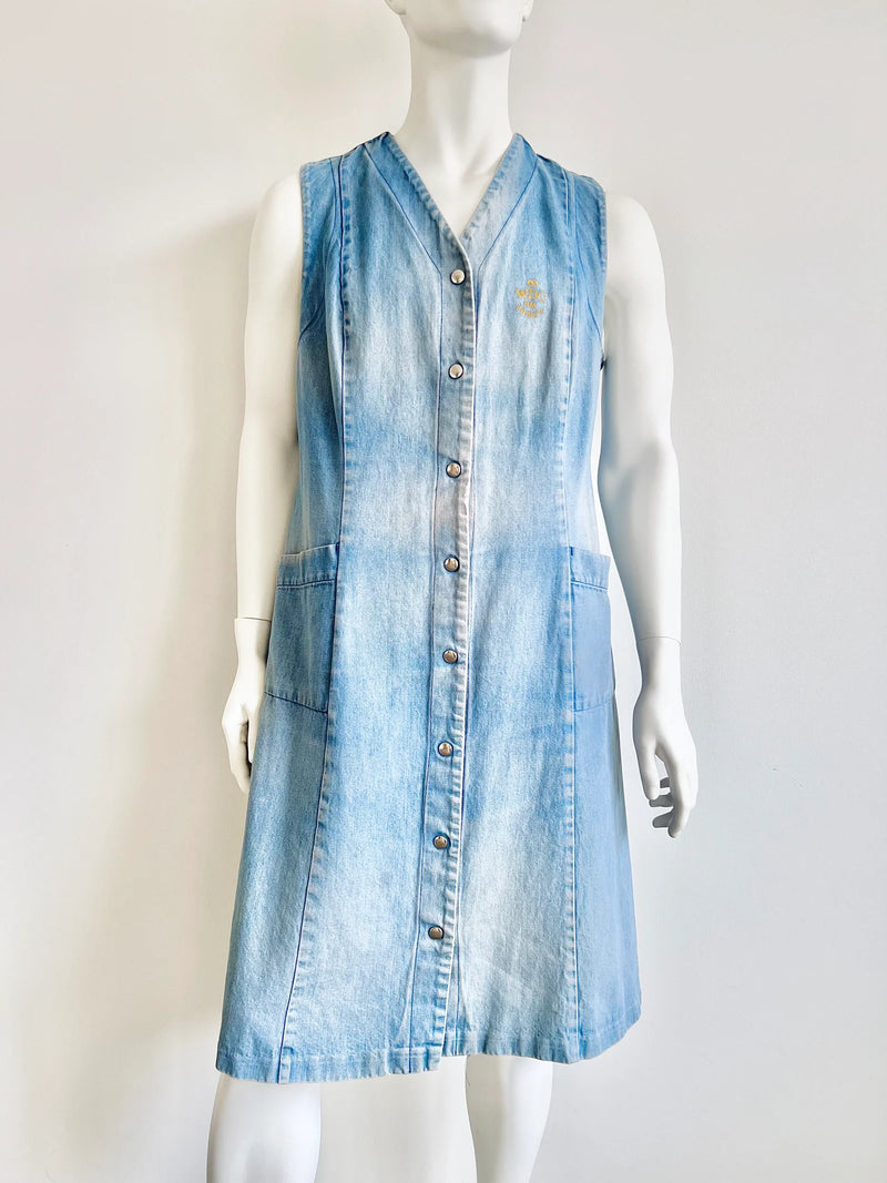 Light blue denim dress on a mannequin against a white background