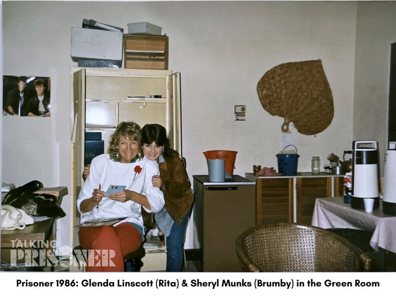 Two women in a room with furniture and decor from the 1980s, with text indicating a TV show and year.