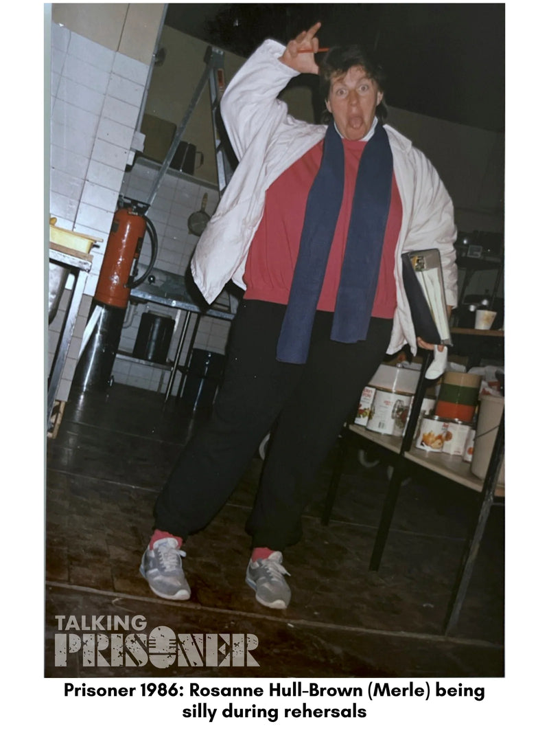 Person in a costume with text 'Prisoner 1986' and 'Rosanne Hull-Brown (Merle) being silly during rehearsals'.