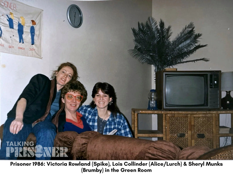 Three women sitting on a couch in a room with a television and decor from the 1980s.