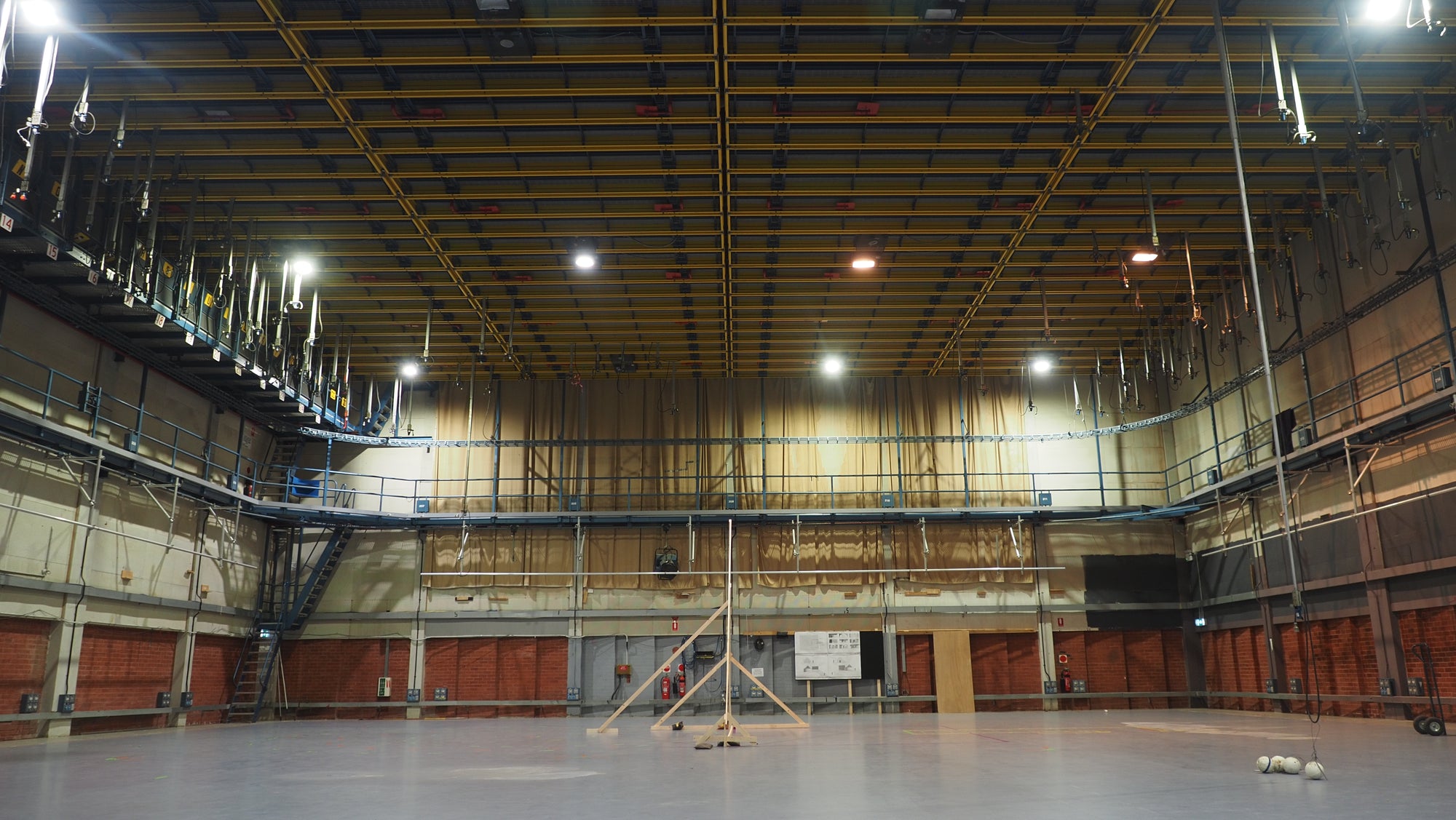Large production studio with polished grey flooring and high ceilings